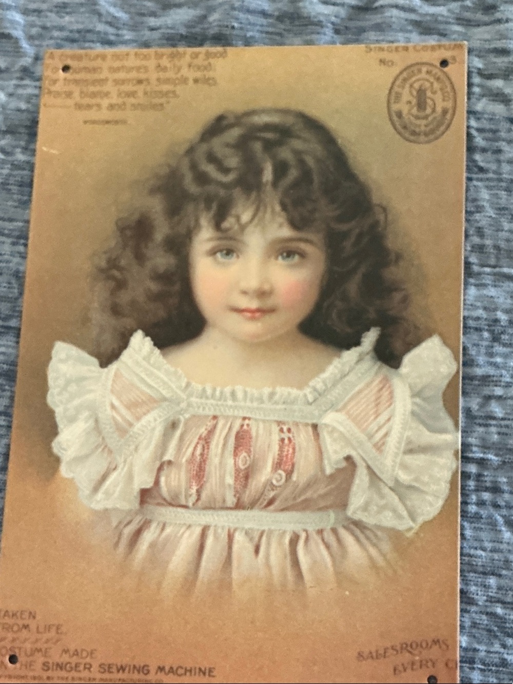 Lovely Singer Trade card metal picture. Little girl wearing dress made on Singer